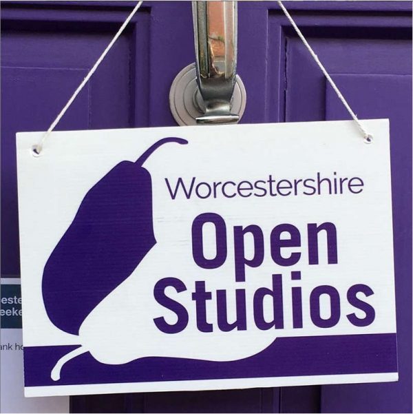 Open Studios sign hanging from a door handle