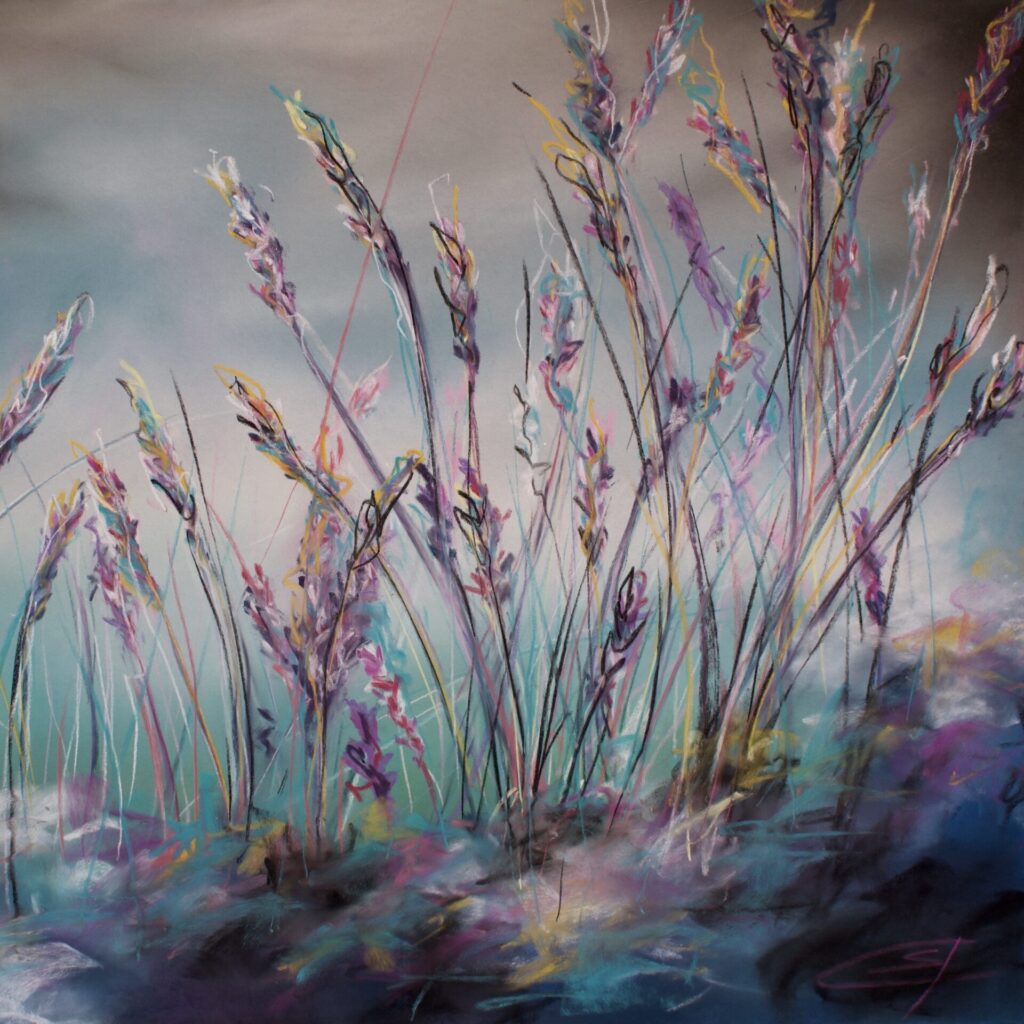 Pink and purple wildflowers viewed from a low vantage point. A background of subtle turquoise blended into a sky of distant clouds.