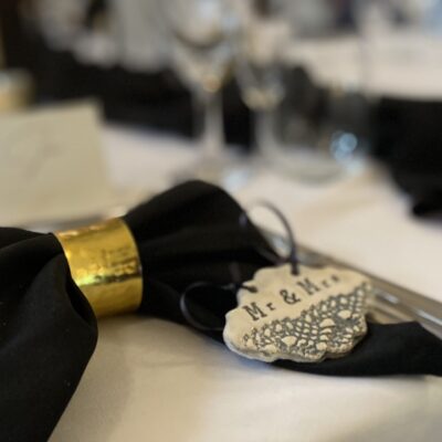 Katie Beasley - Art Clay Love A handmade ceramic place setting as a wedding favour.  Scalloped shaped with ribbon to match the table napkin.