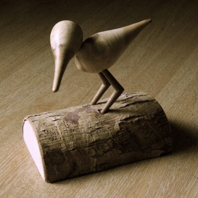 Derek Ruskin - Birds sitting on tree trunk