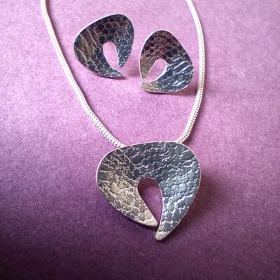 Belinda Gilbert - Textured silver shell form earrings and pendant