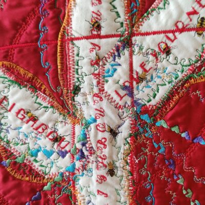 Julie Lloyd Owen - Details of a larger work. Machine embroidered and quilted on recycled handkerchief. Titled Love your neighbour....