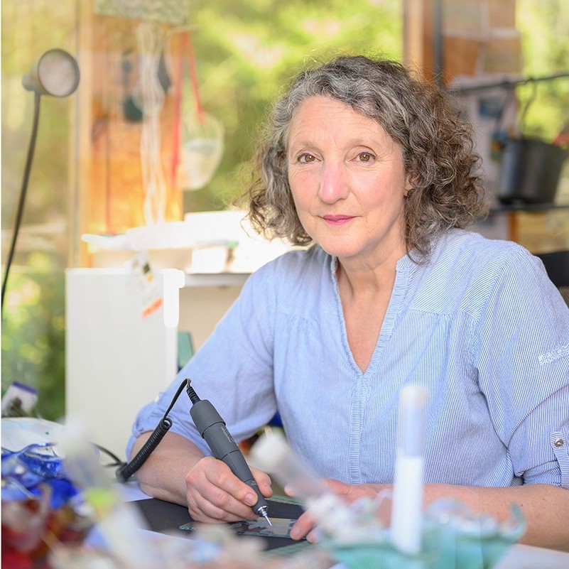 Artist engraving glass