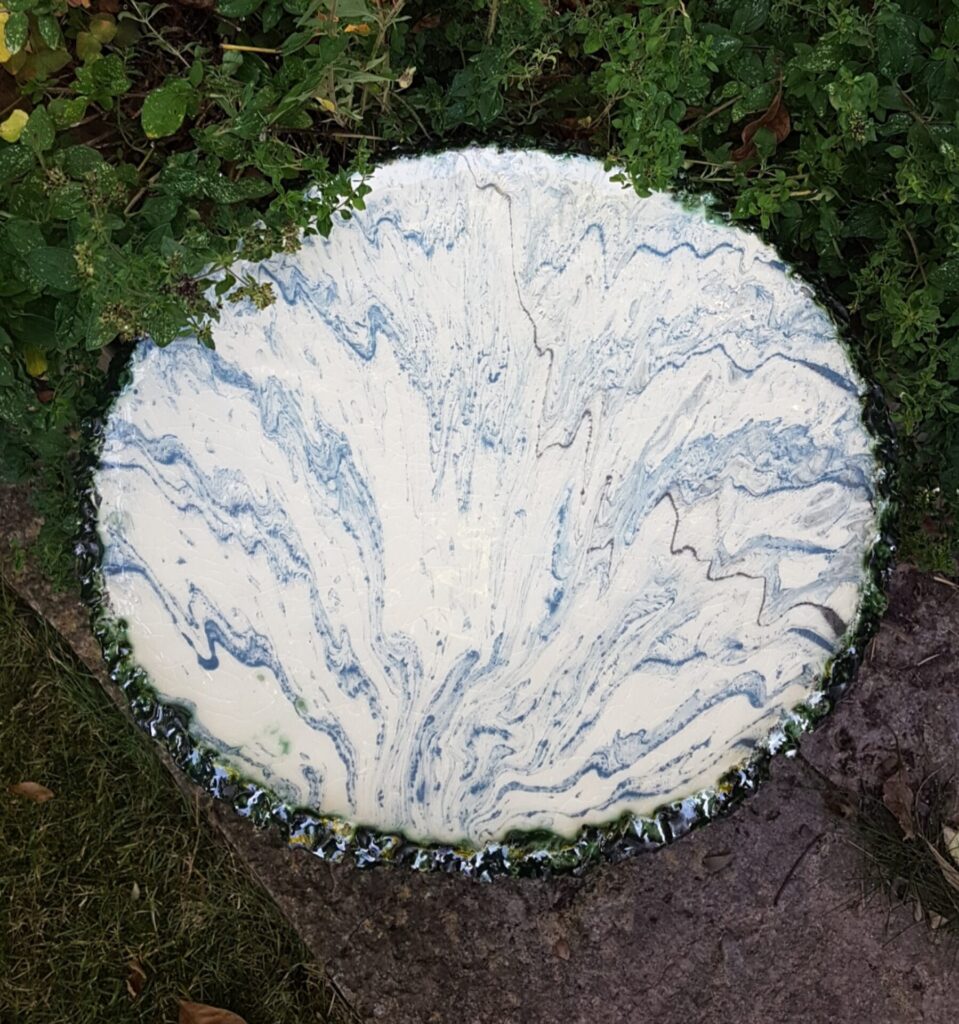 Large plate decorated with fluid slipware designs