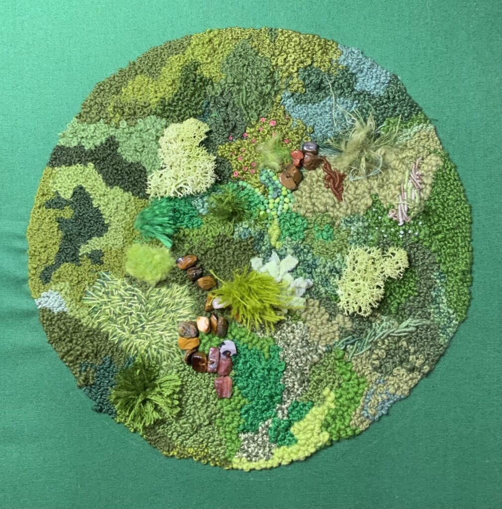 Abstract textile artwork with layered embroidery, radiating stitches, knots, and mesh textures on neutral fabric.
