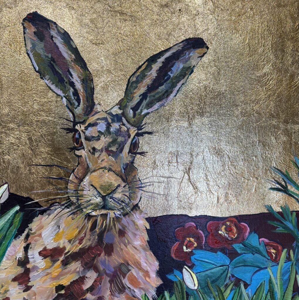 Hare on imitation gold leaf.This hare is gently hidden amongst the lush, rich flowers.Acrylics has been painted over the gold leaf which adds depth and a richness which enhances the hare’s fur.I paint animals with a character , with respect and celebration.