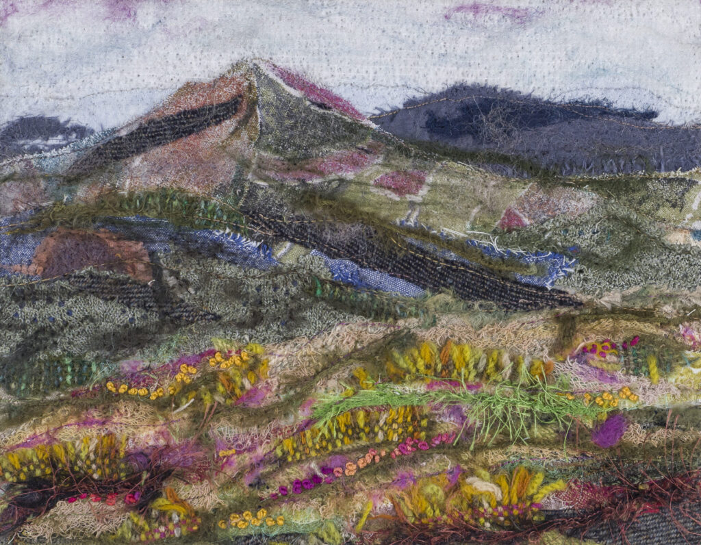 Malvern Hills - vibrant fabric landscape embellished with hand and machine stitching.