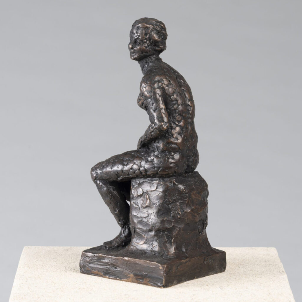 Bronze seated figure of Pandora, sculpted by Charlotte Hern.